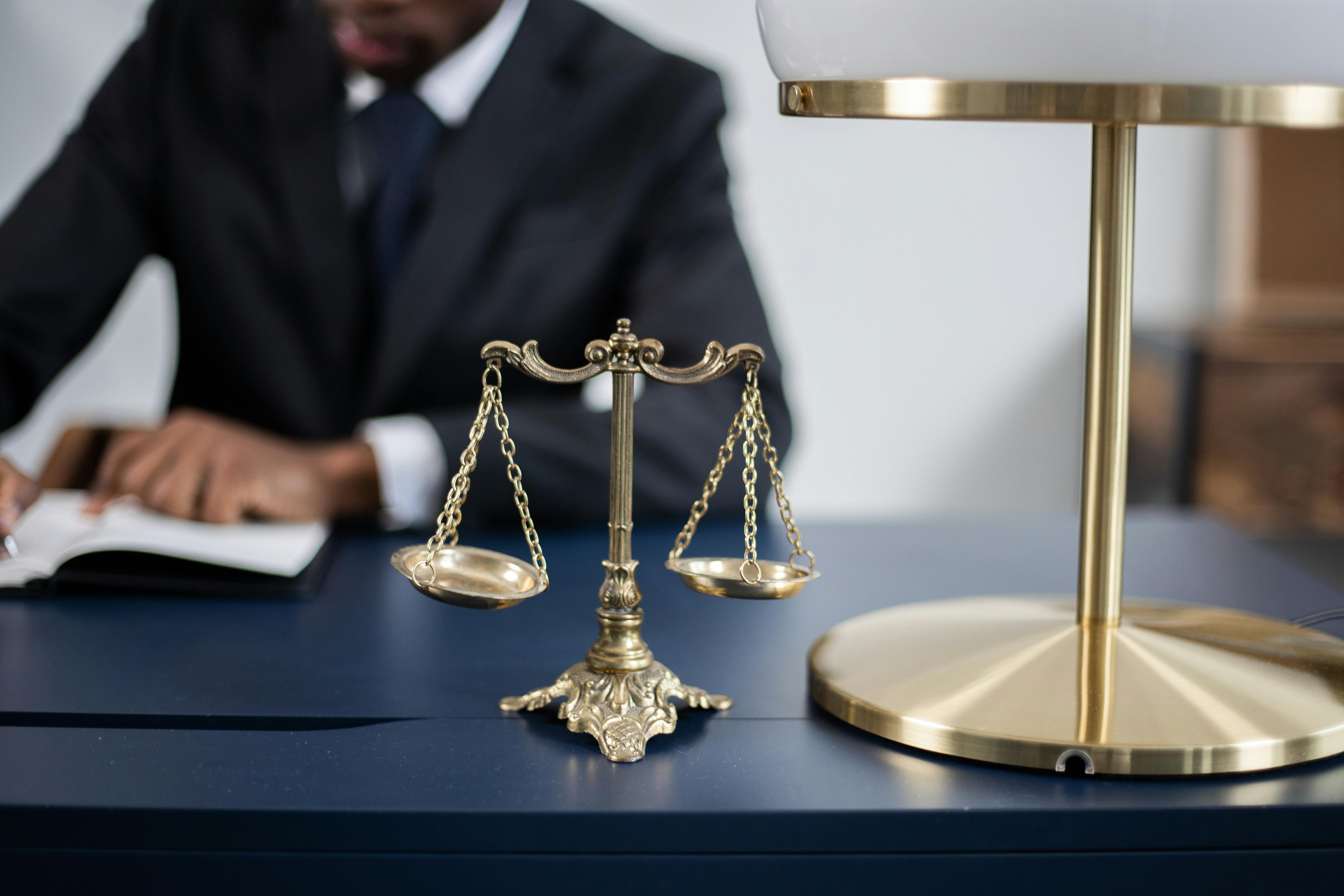 Scales of justice on a professional desk